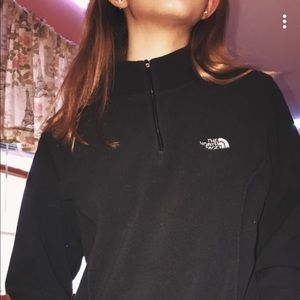 a black North Face zipper up sweater🍁
